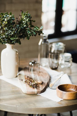 still life kitchen table, wooden board, vase