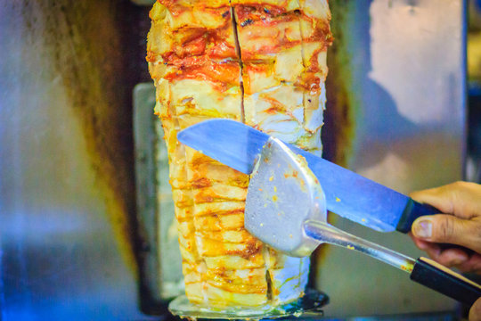 Traditional Turkish food, Doner Kebab in the restaurant. Lamb and Chicken Doner Kebab. Grilled skewered lamb mutton, a traditional meat kebab sandwich.