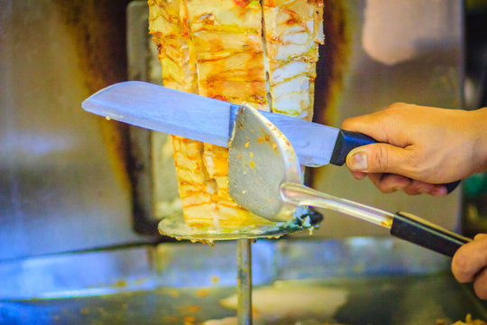 Traditional Turkish food, Doner Kebab in the restaurant. Lamb and Chicken Doner Kebab. Grilled skewered lamb mutton, a traditional meat kebab sandwich.