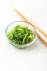 Wakame seaweed salad with sesame seed. Traditional Japanese food.