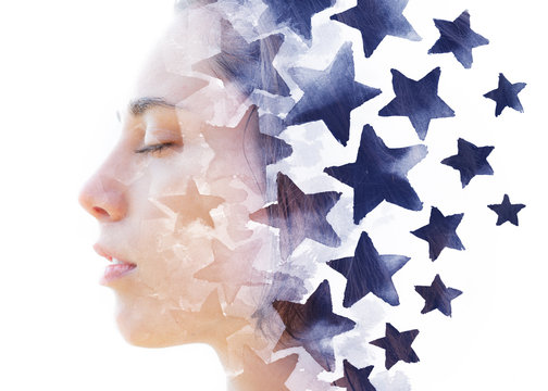 Paintography. Double exposure of a young model combined with hand drawn painting of repeating blue stars