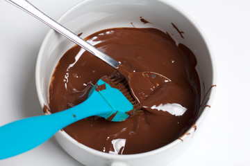 Ingredient for dessert are on the table. Cooking sweets with coconut and condensed milk. In a glaze of white and black chocolate.