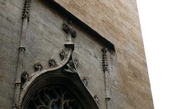 ornaments and sculptures of the Gothic period on the gates of a church in Valencia