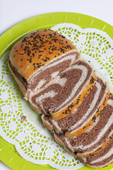 Freshly ruddy bread. The slice shows cocoa blotches.