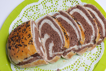 Freshly ruddy bread. The slice shows cocoa blotches.