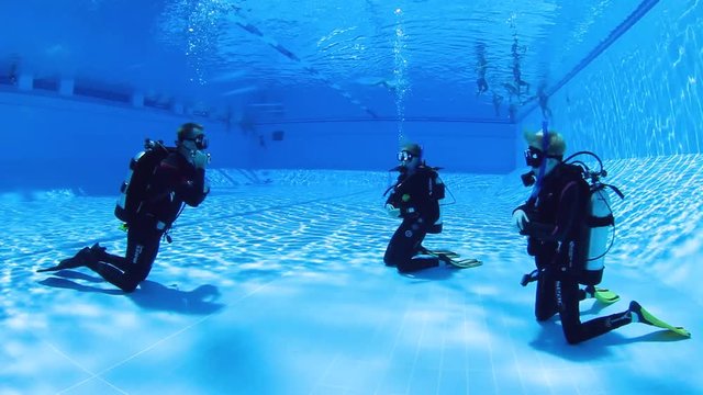 Children learning to scuba dive