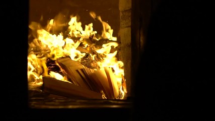 Slow Motion of people burning joss paper in ancient asian temple Taiwan. Burn the ghost money is a tradition in honor of the ancestors for the spirit of the deceased has good things in afterlife-Dan
