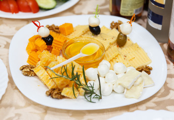 Cheese plate with honey and nuts