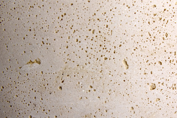 Fototapeta na wymiar Relief background of beige sandstone