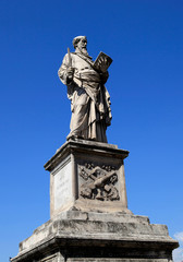 Fototapeta na wymiar Statue on the Saint Angelo bridge over the Tiber river in Rome, Italy