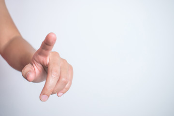 The close-up image of the hand is pointing to the computer screen.