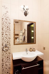 Bathroom design in golden and brown colors