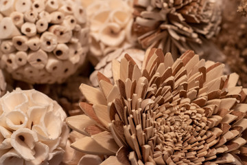 Closeup of wooden flowers and balls