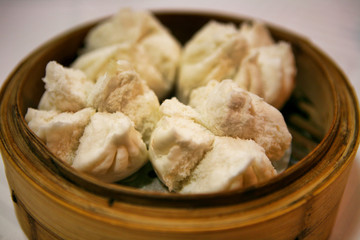  Chinese buns cooked in a traditional bamboo steamer.