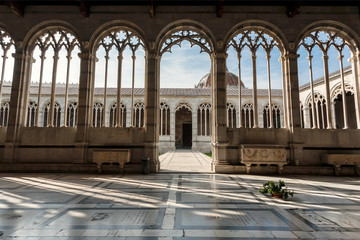 Sun light in wide windows of 13th century Camposanto Monumentale, ancient cemetery of Tuscany