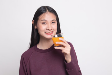 Young Asian woman drink orange juice.