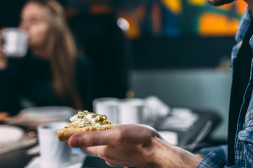 eating cheese pizza in the office at the workplace