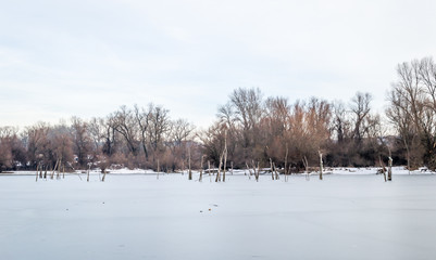 Sunset over the lake in the winter