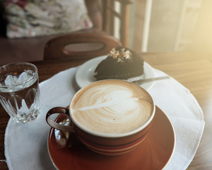 cup of hot coffee on table closeup with latte art pattern