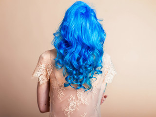 blue hair hairstyle curls girl's back bright hair color creative painting in a bright shade colorist work summer style