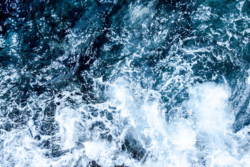Blue deep sea foaming water background