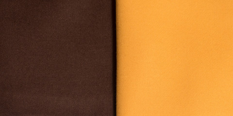 Fototapeta premium Backgrounds and textures. Brown and orange cotton fabric close-up