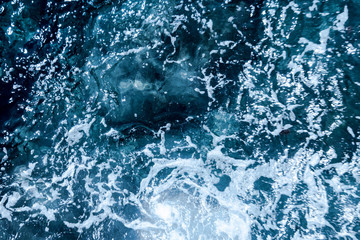 Blue deep sea foaming water background