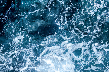 Blue deep sea foaming water background