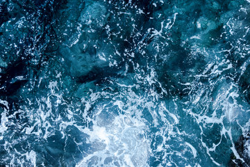 Fototapeta na wymiar Blue deep sea foaming water background