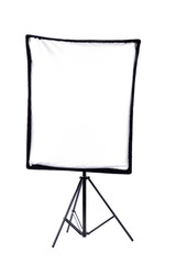 Lighting device on a tripod. Front view studio flash isolated on white background with clipping path. Photographic equipment for photographers.
