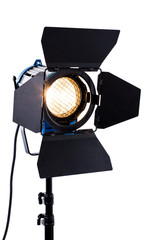 Professional studio lighting on white background. Spotlight with stand. Flashlight with light barn...