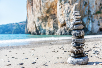 Fototapeta na wymiar Stone Stack on a Beach in Southern Italy