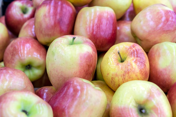 Red apples on the showcase of a rural market.