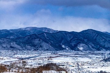 Fototapeta na wymiar Snowy countryside view in the winter of Japan.