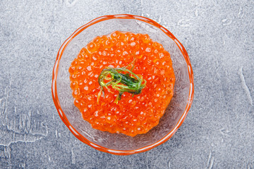 Salmon caviar in glass plate