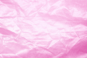 Fototapeta premium Elegant pink textile background. Silk cloth texture. Fabric pattern.