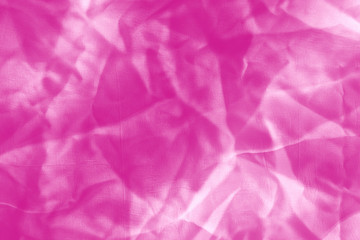 Elegant pink textile background. Silk cloth texture. Fabric pattern.