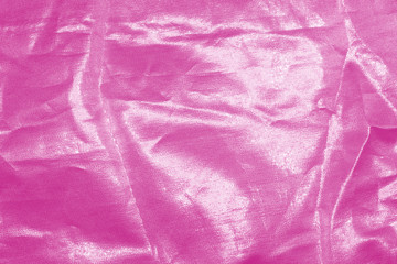 Elegant pink textile background. Silk cloth texture. Fabric pattern.