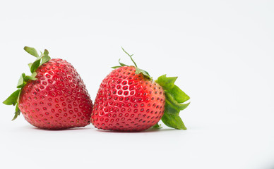 Two red strawberries On the white background