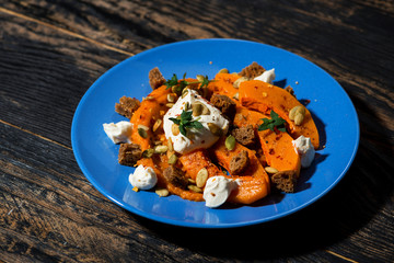 baked pumpkin salad with cream cheese and croutons