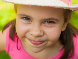 Beautiful brunette girl smiling, close-up. Summertime. brown eyes, long eyelashes.