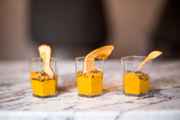 Homemade pumpkin mousse or cream in glasses sprinkled with cinnamon