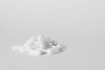 Pills on plain background