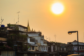 Fototapeta na wymiar Cityscape of dense community village at Klong Mahanak canal in Bangkok nearby the famous traveling place,Golden Mountain or Wat Saket