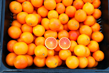 box of oranges with vitamin C essential to deal the ailments of