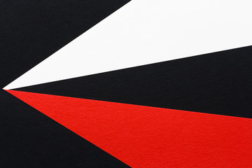 three-color geometric background of white black and red paper