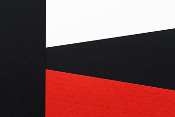 three-color geometric background of white black and red paper