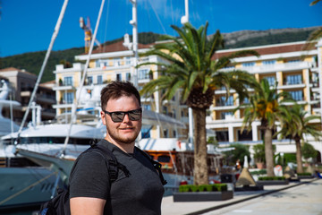 portrait of man yachts and dock on background