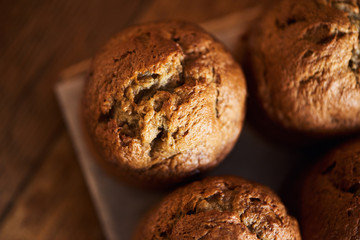 Freshly baked muffins cooling on a bakery table