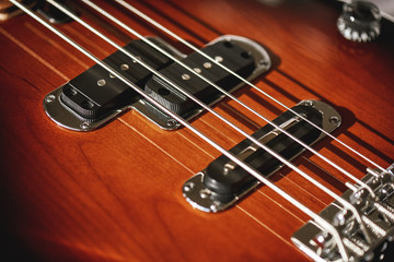 Guitar body. Close-up view of electric guitar body with metal strings and pickups. Musical instruments
